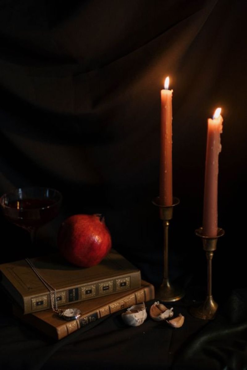 Antique book stack candle dark art card elegant Halloween table styling end