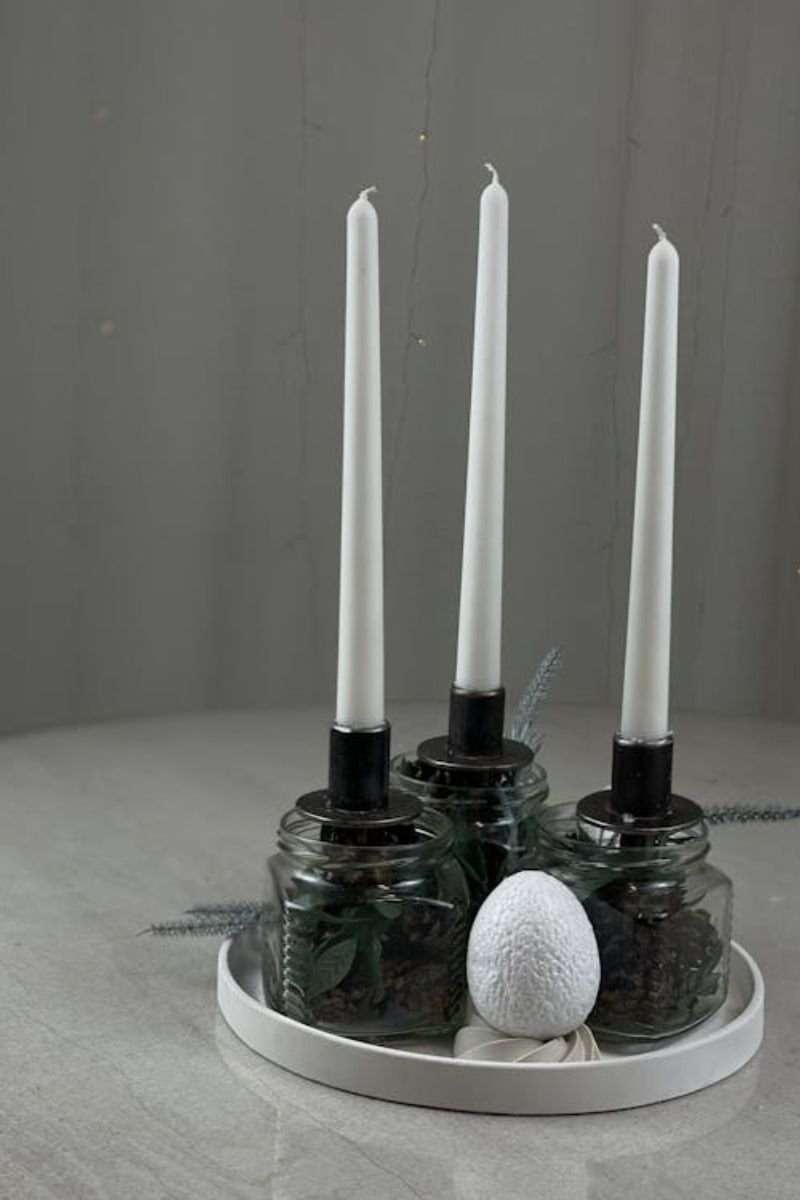Apothecary jar centerpiece black sand taper candle botanicals elegant Halloween table