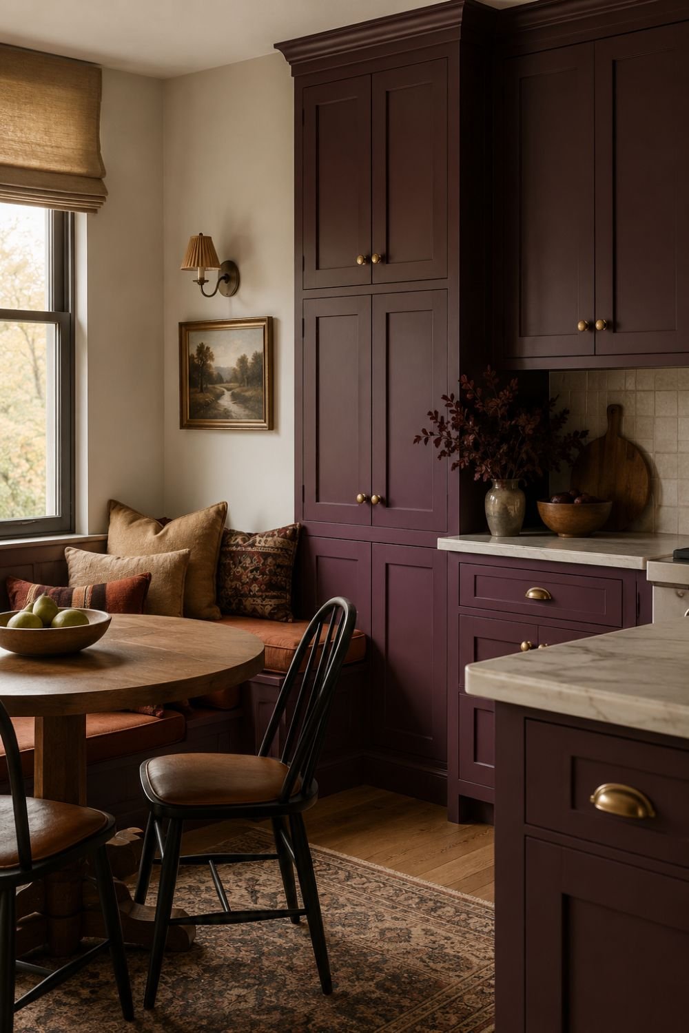 Aubergine kitchen with warm cushioned seating creating cozy nook.