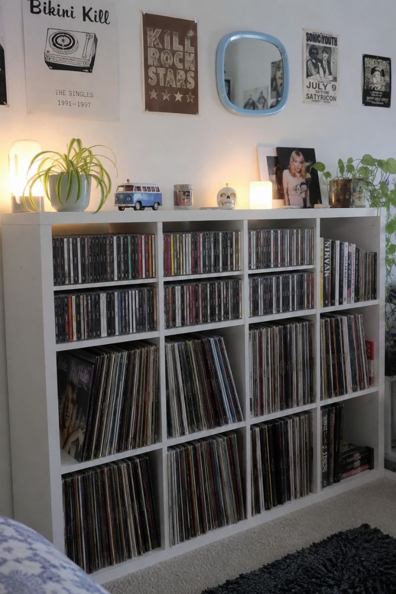 CD and vinyl record display in white cube shelving in Y2K bedroom