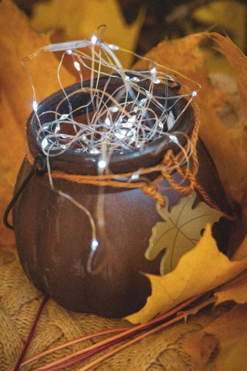 DIY mason jar luminary faux fall leaves glue tea light Dollar Tree craft