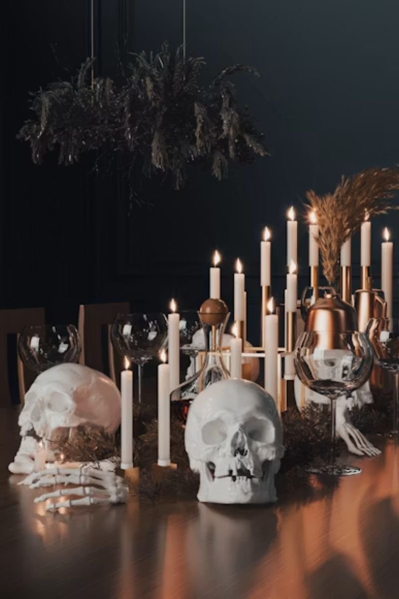 White ceramic skull dark burgundy dahlia florals elegant Halloween table centerpiece
