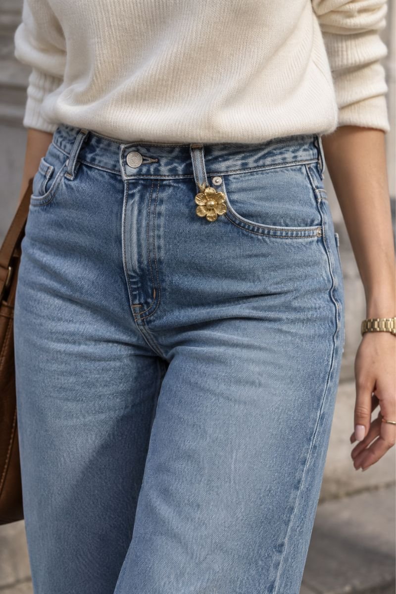 brooch clipped to belt loop on jeans