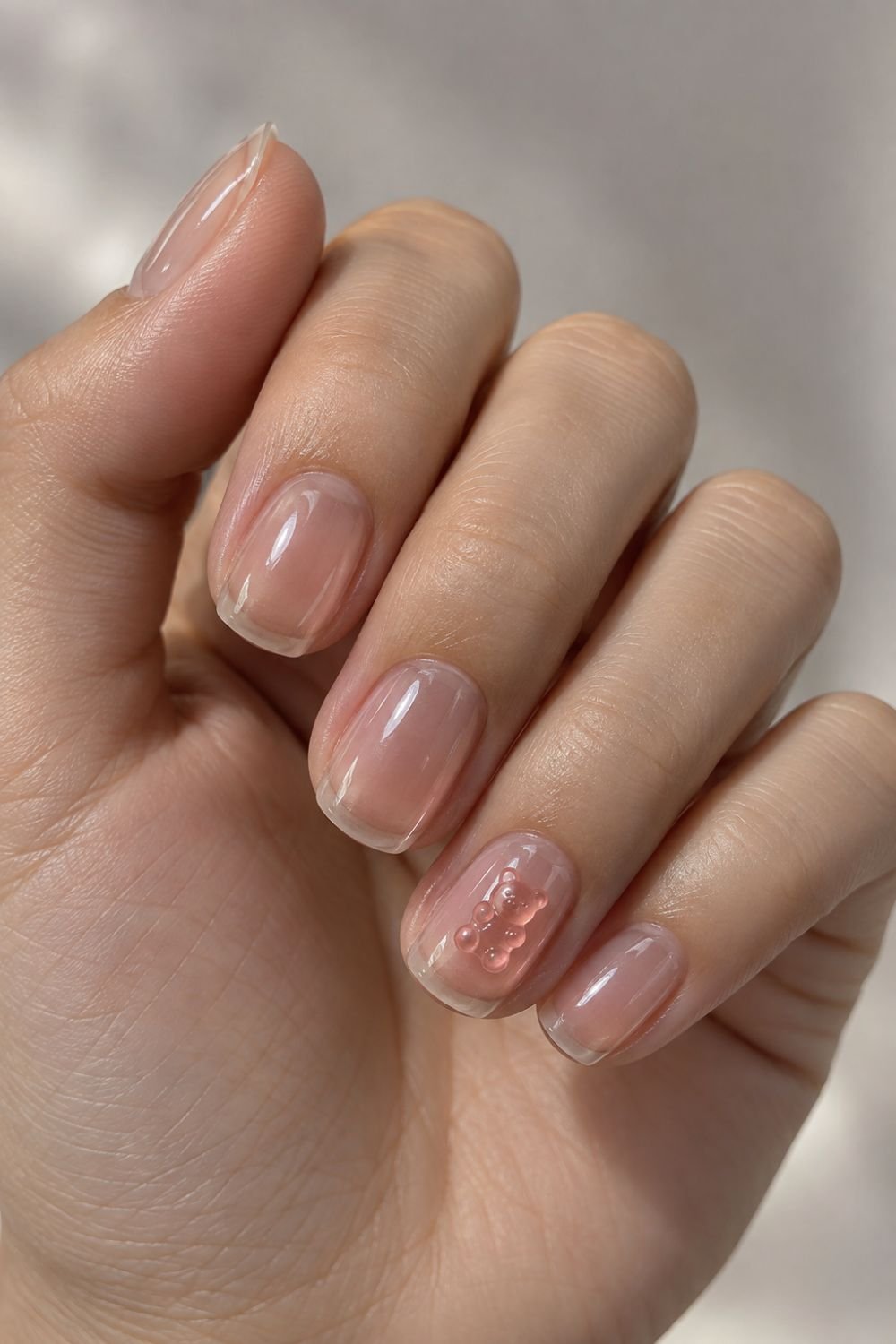 clear jelly nail polish with gummy bear charm