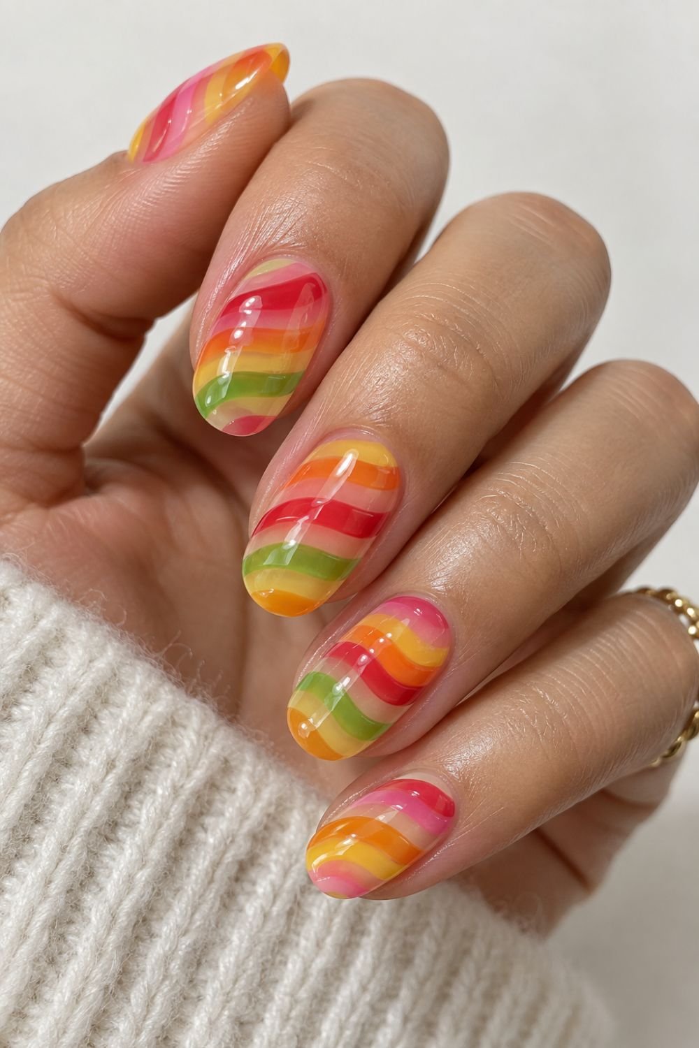 gummy worm inspired striped nail art]