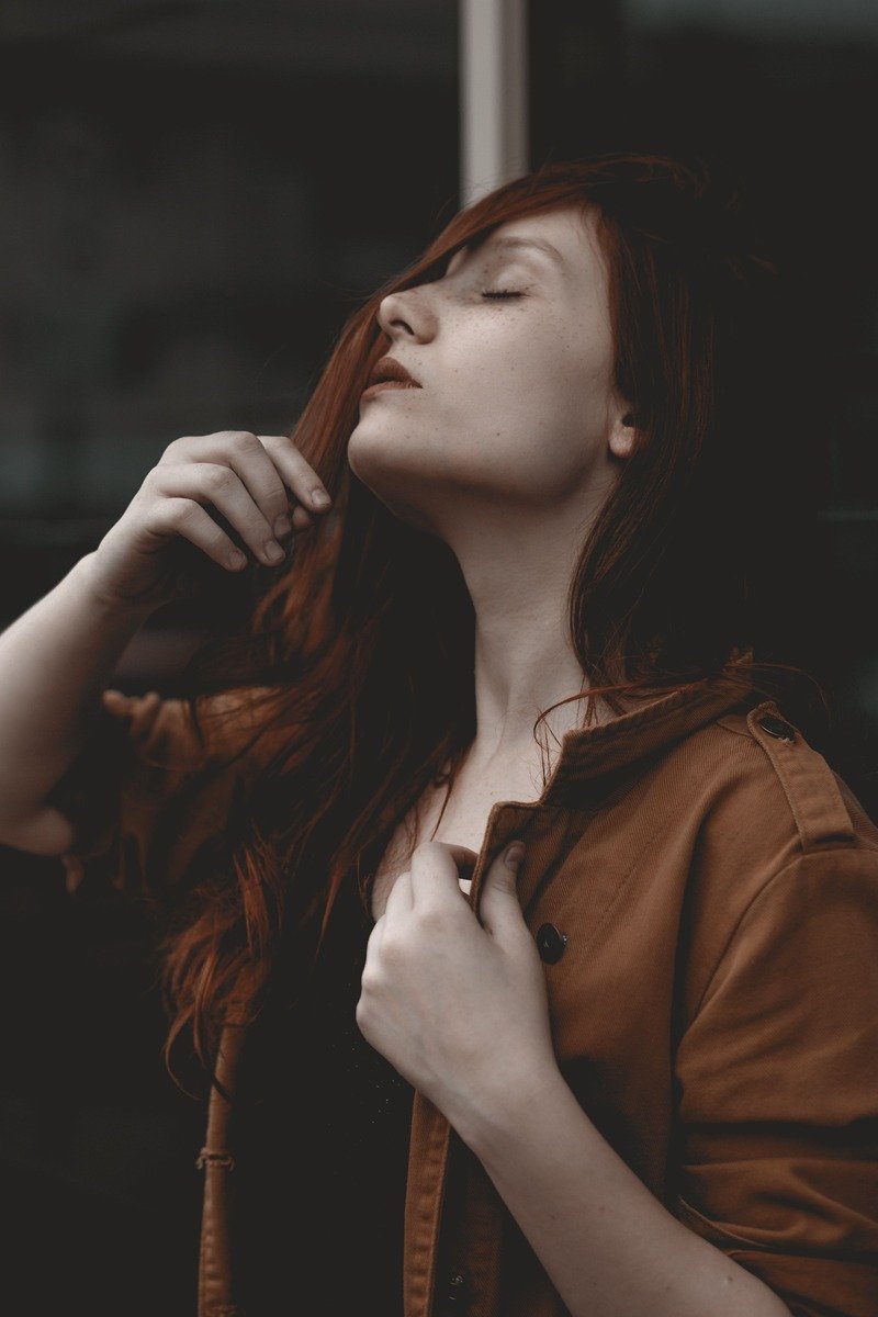 Woman with classic cherry cola hair color, deep brown with red tones