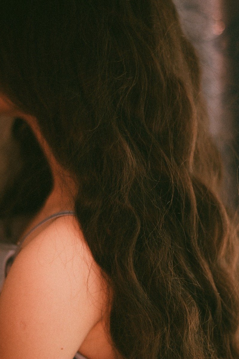 Woman with glossy espresso brunette winter hair color
