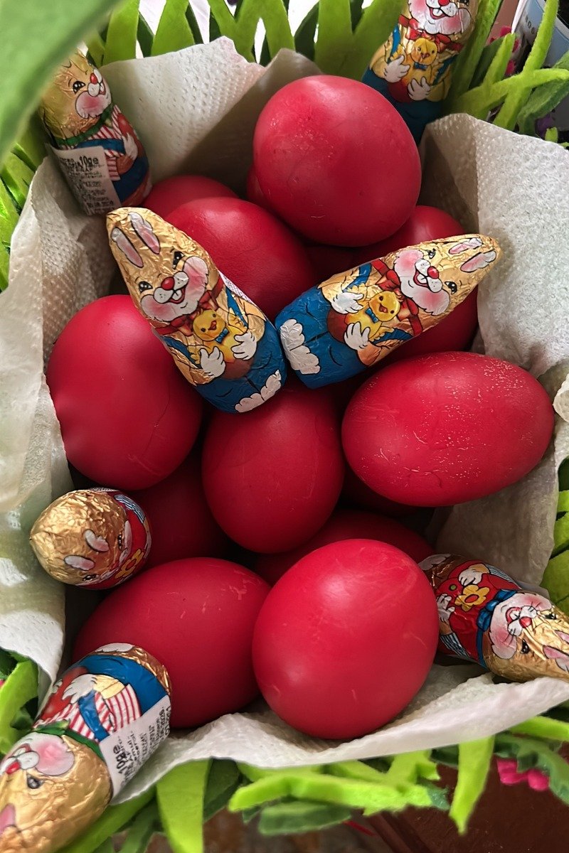Easter basket filled with chocolate eggs and candy
