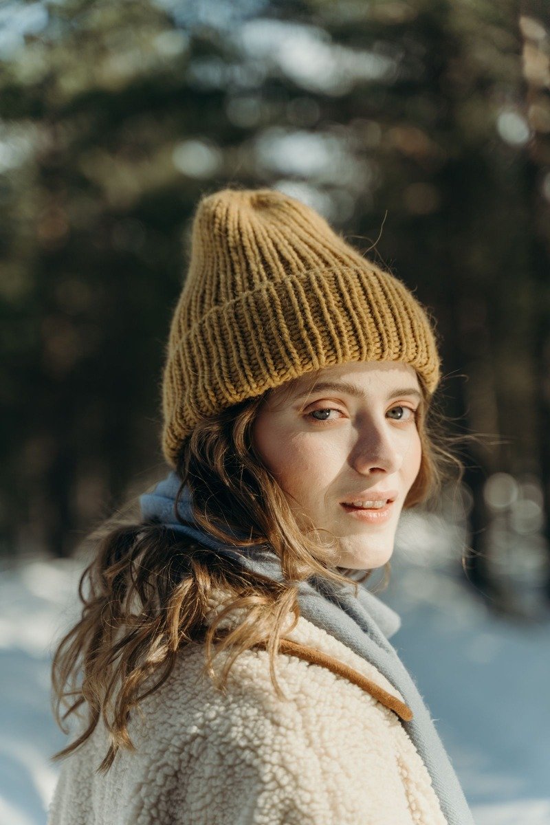 Woman wearing a wool beanie in winter