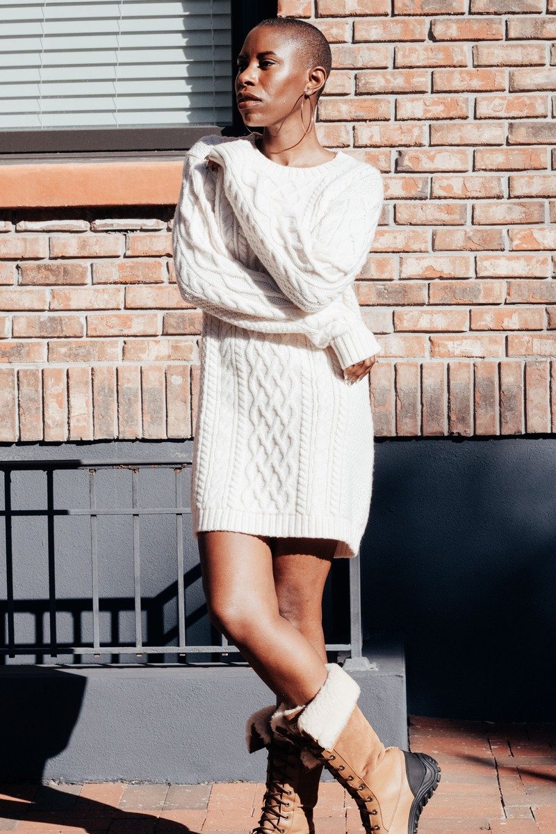 Woman in a sweater dress with ankle boots