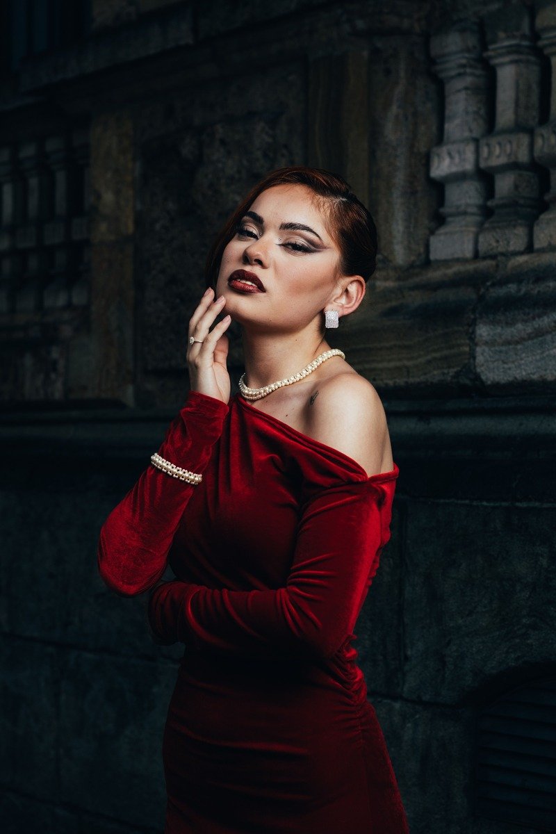 Woman in a velvet dress at night