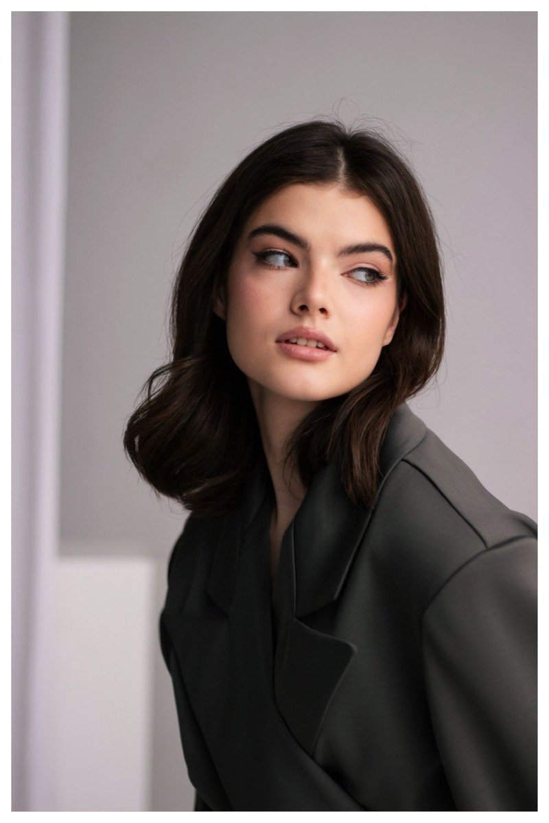 Shoulder length lob haircut with mocha balayage highlights and soft waves