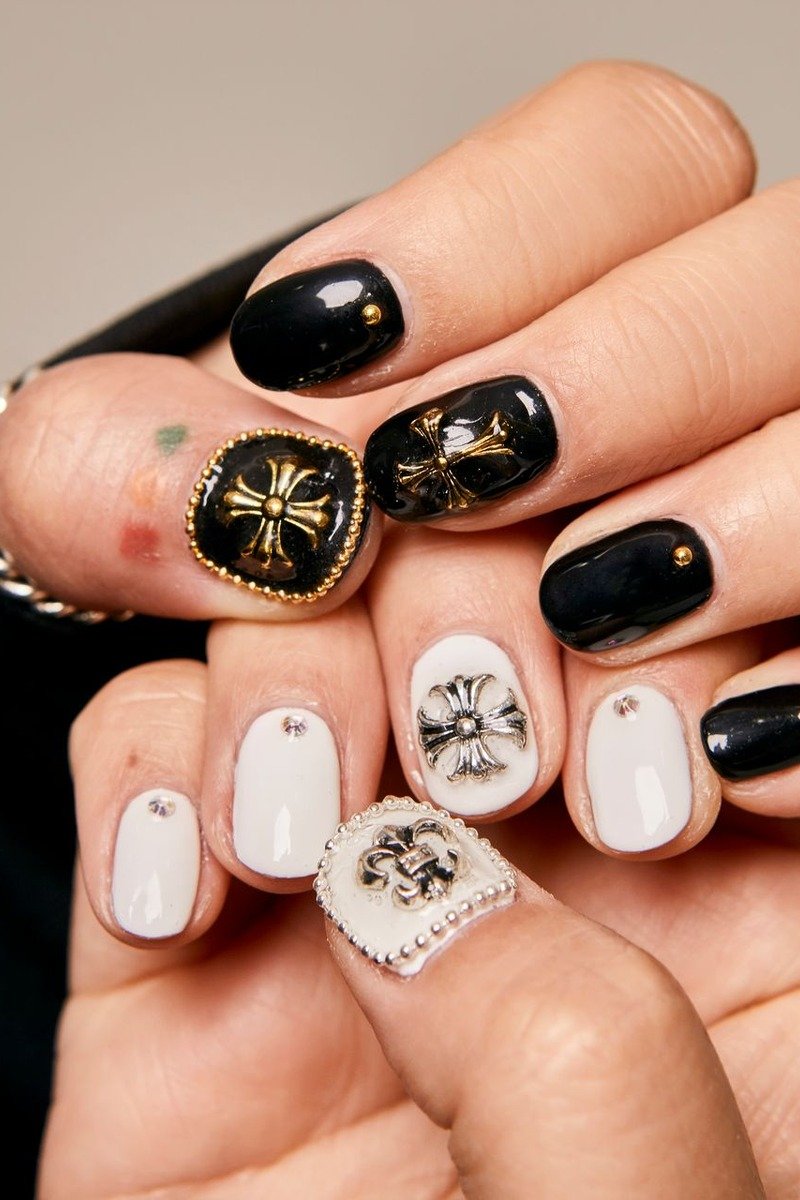Nude nails with black lace accent nail design
