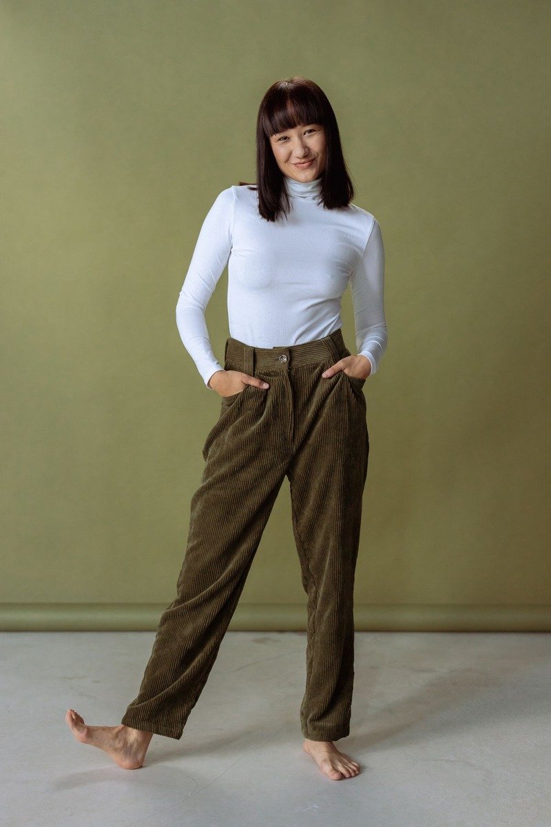 Woman in a turtleneck and corduroy pants on a winter day