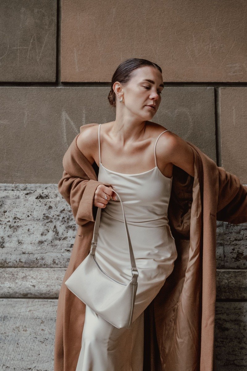 Satin slip dress with a long wool coat date night outfit
