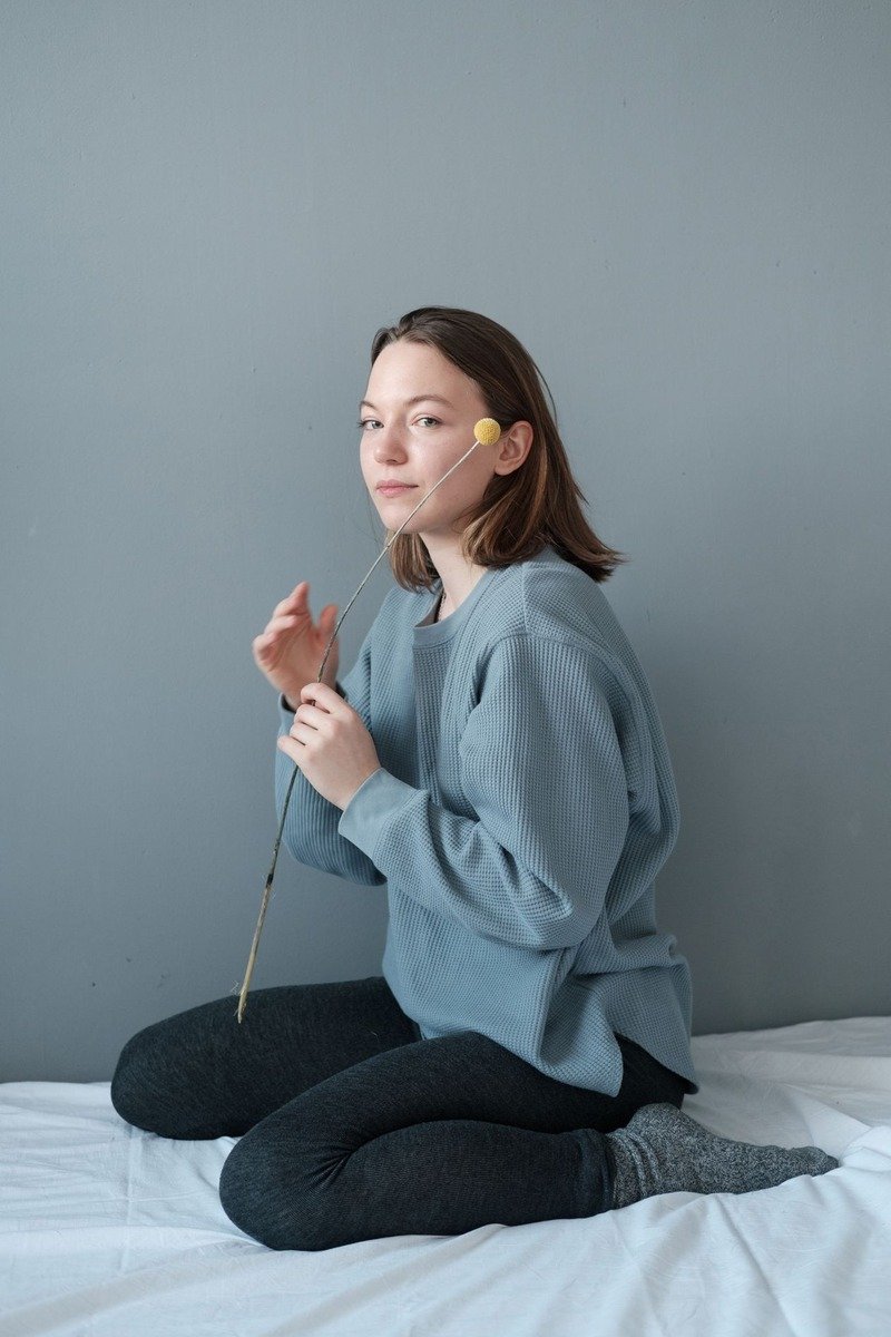 Mom wearing high-waisted leggings with an oversized sweater
