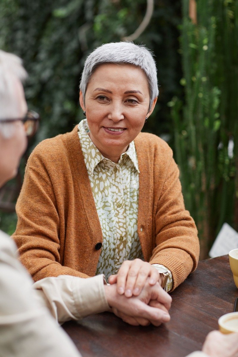Woman over 50 with a very short grey crop haircut