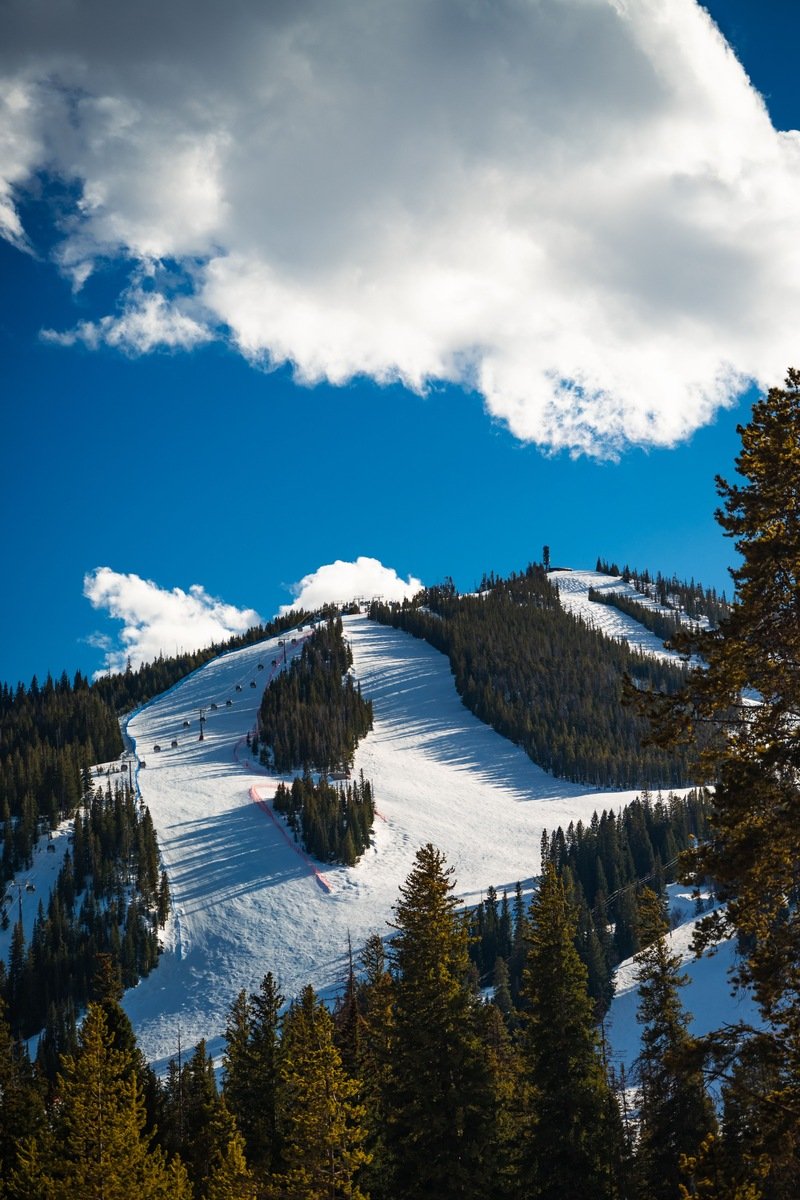 Ski slopes with a chairlift on a bluebird day in Montana