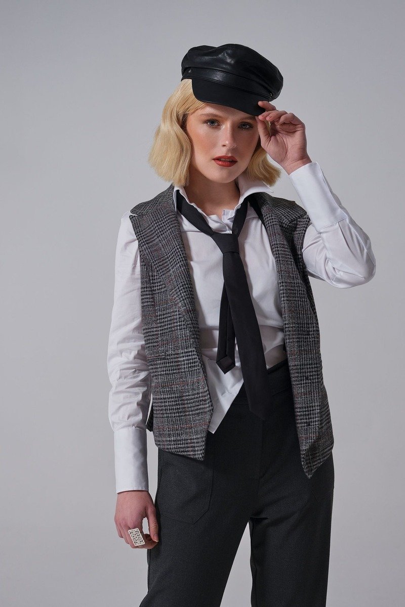 Longline vest over a shirt and trousers