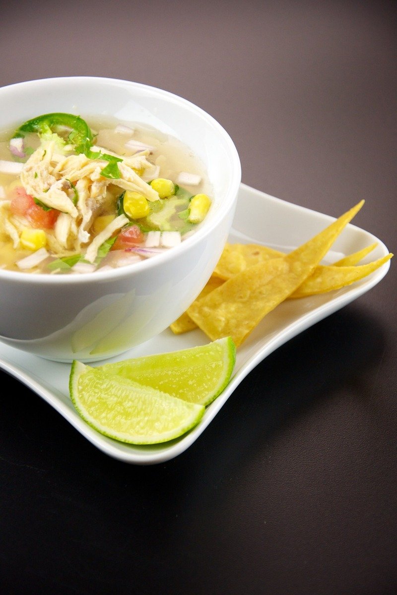 Chicken tortilla soup with toppings