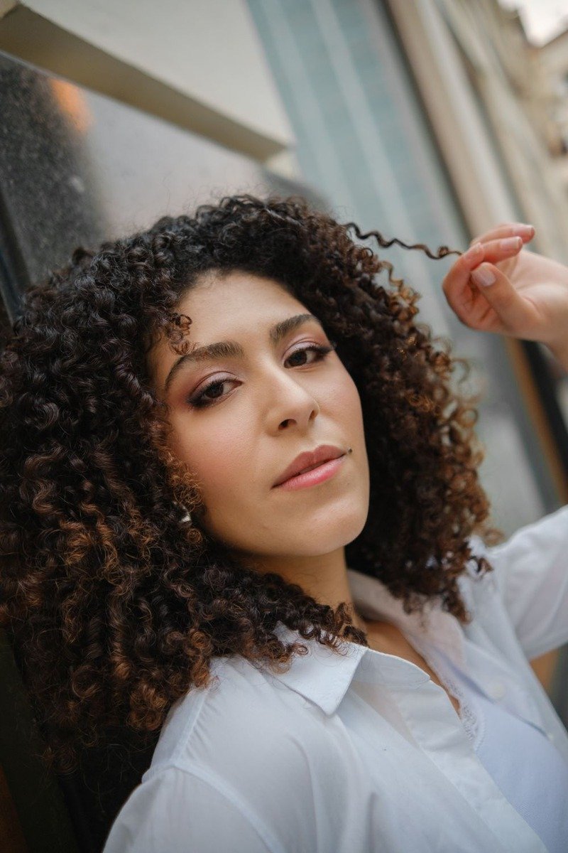 Curly hair with dimensional mocha balayage showing chocolate and caramel tones