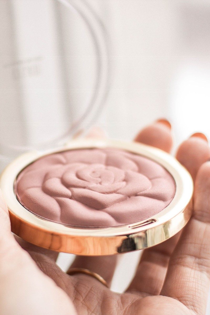 Baked dusty rose blush with marbled pattern in compact