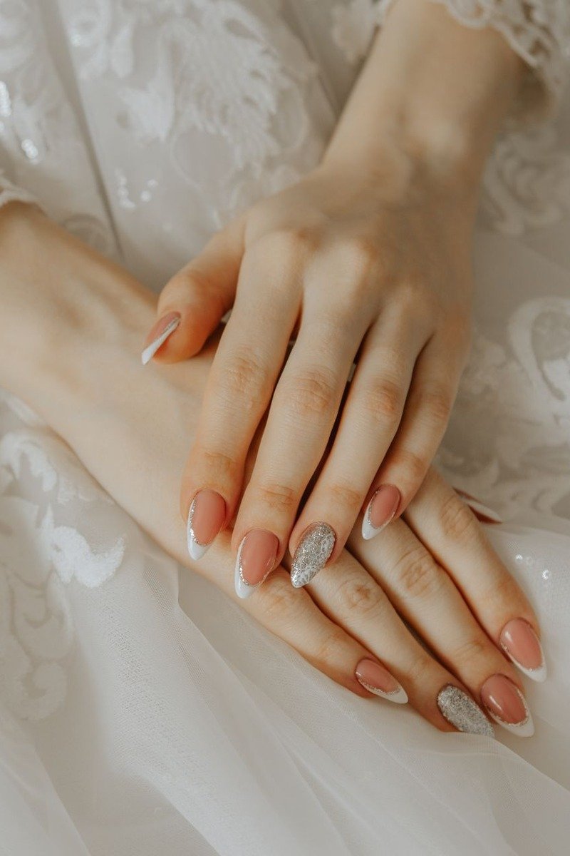 Ivory nails with intricate vintage lace floral pattern