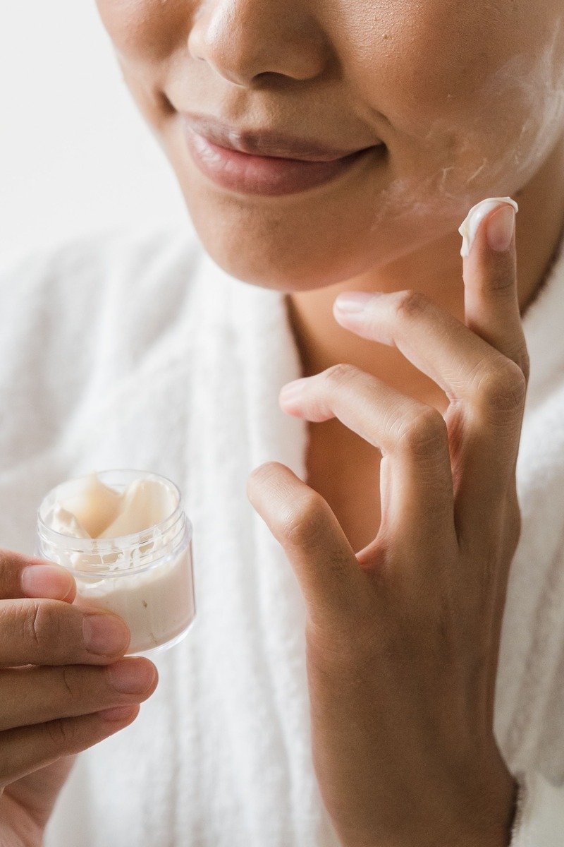 Applying moisturizer to the face