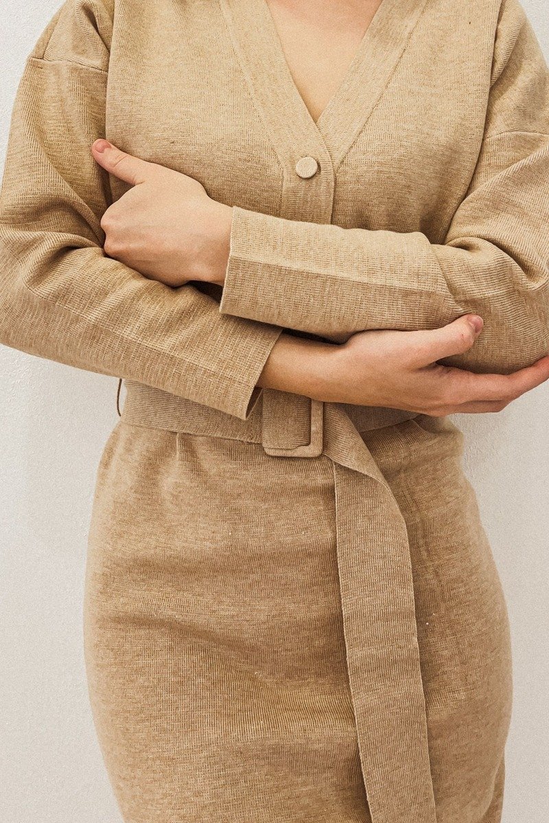 Woman in a knit wrap dress