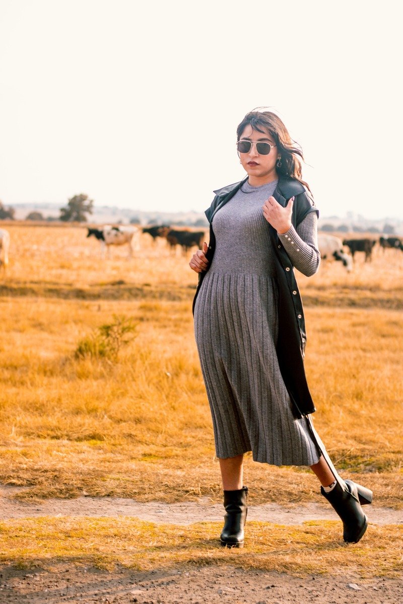 Grey knit sweater dress with black boots