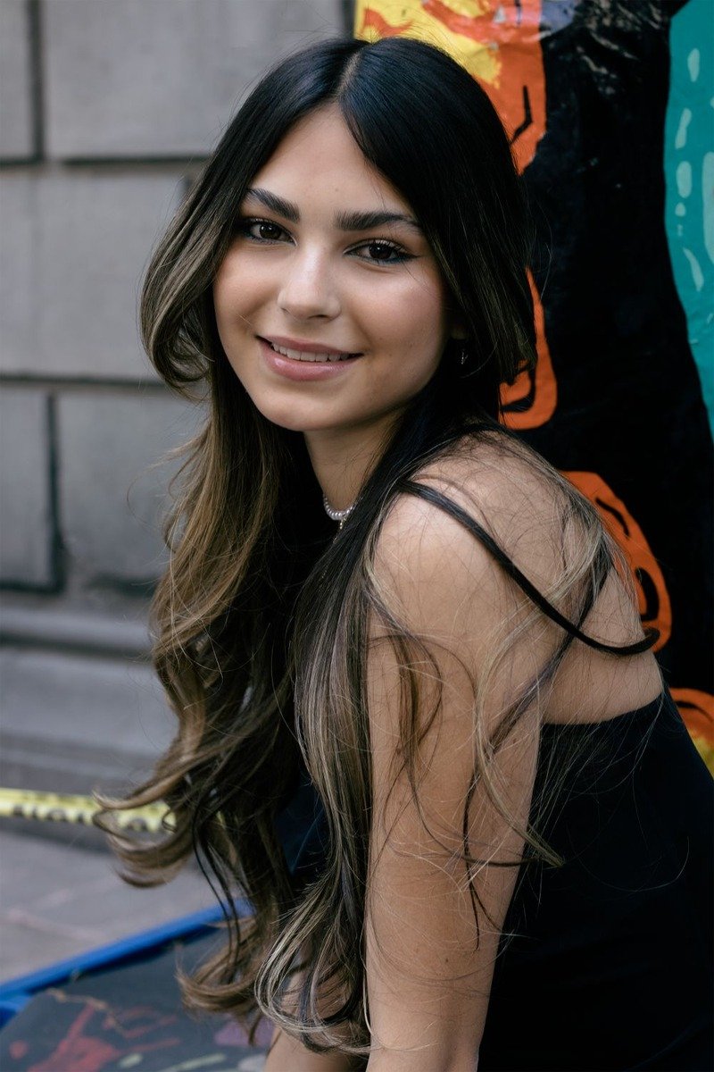 Long brown hair with subtle mocha ribbon highlights woven through