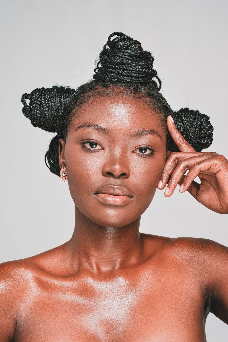 Glassy highlighter on cheekbones over cloud skin base