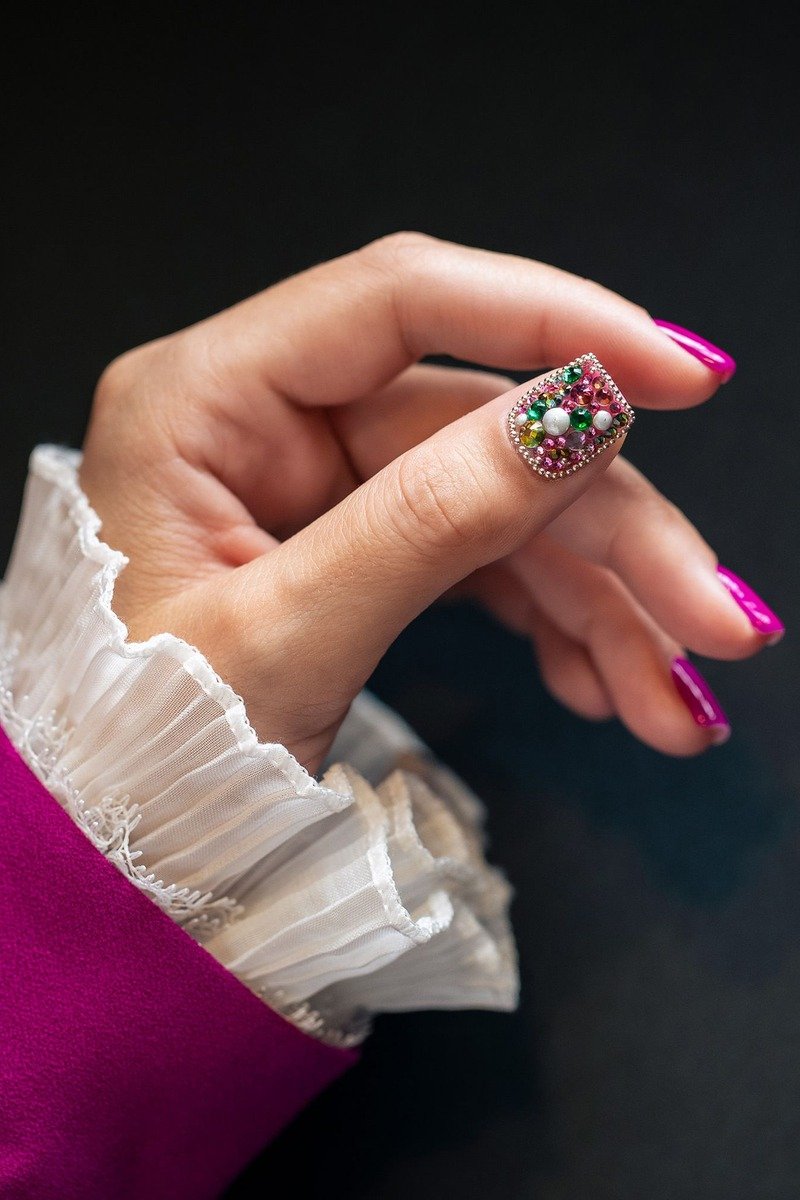 Fuchsia nails with jeweled rhinestone accent nail