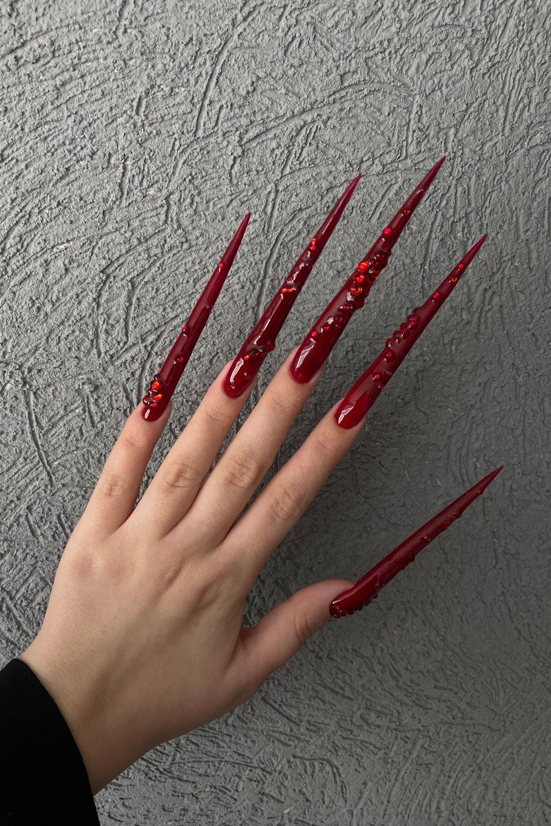 Long scarlet stiletto nails with glossy finish