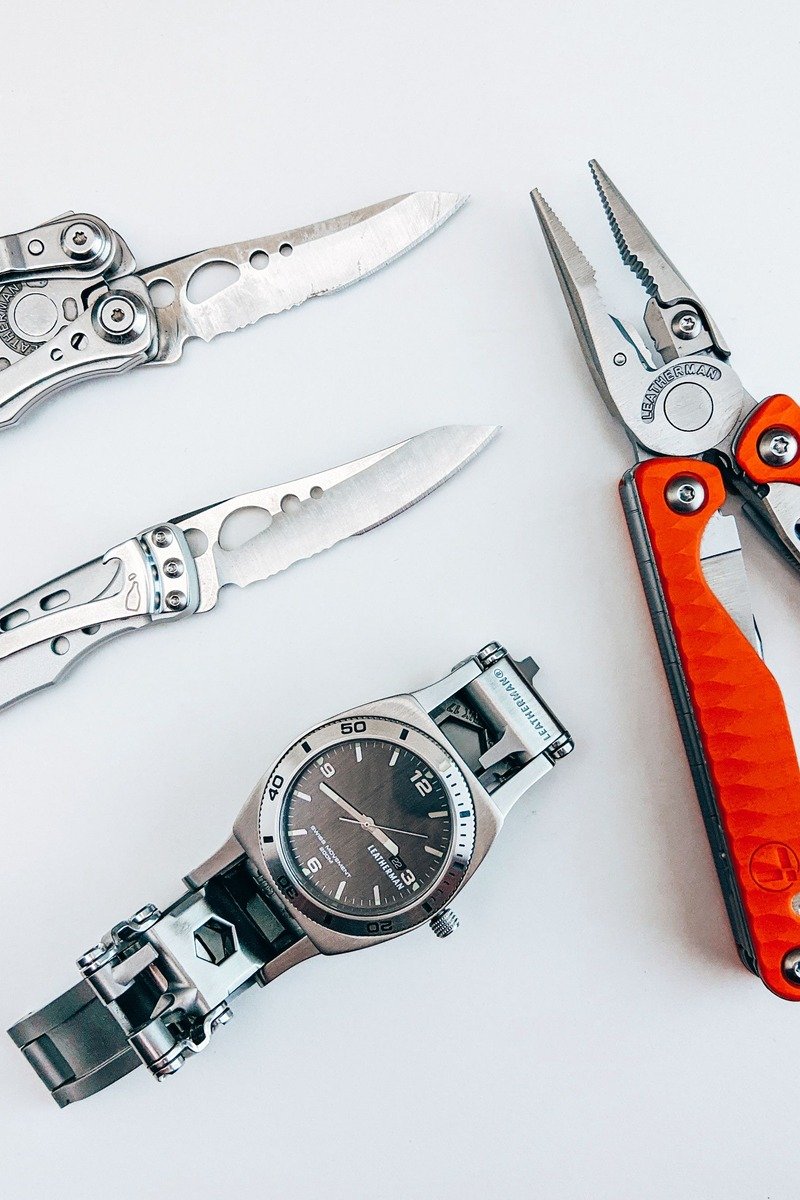 Multitool pocket tools laid out in a flat lay