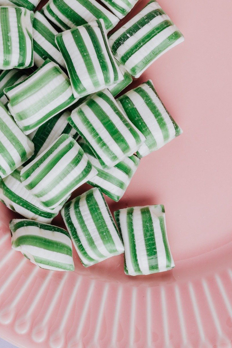 Striped peppermint candies on a small plate