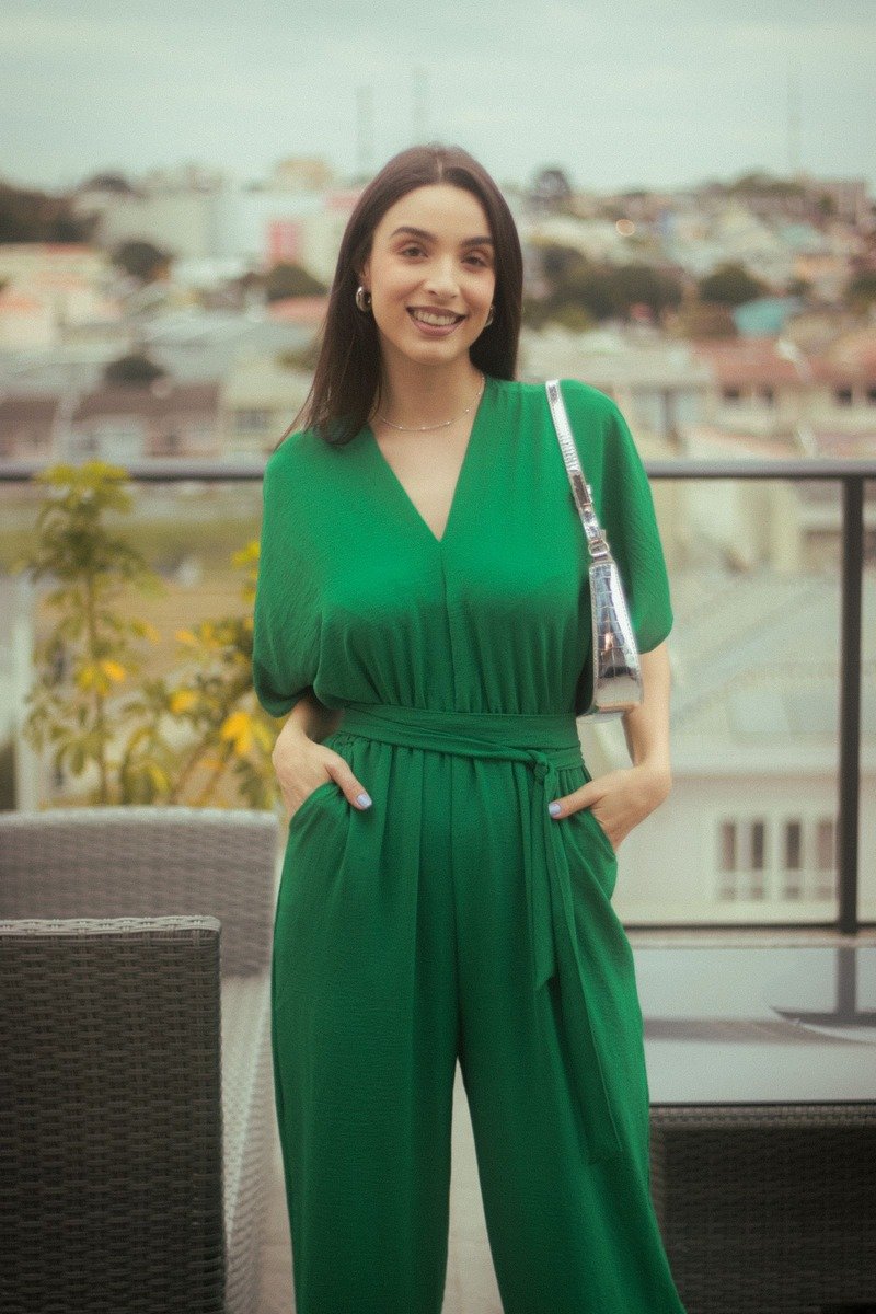 Woman in a green jumpsuit outfit