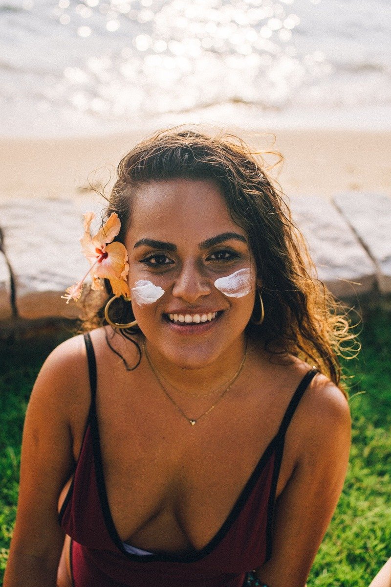 Applying sunscreen to the face