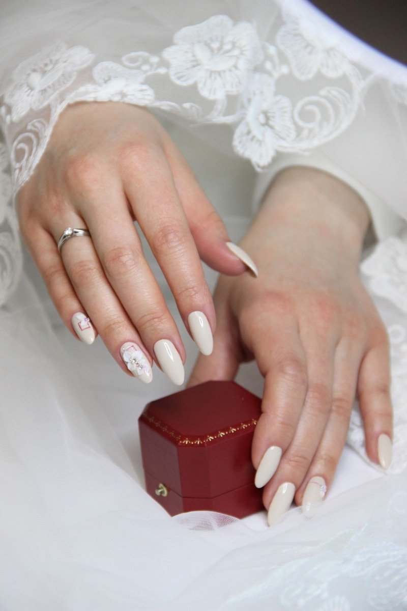 Nails with 3D lace applique pieces attached