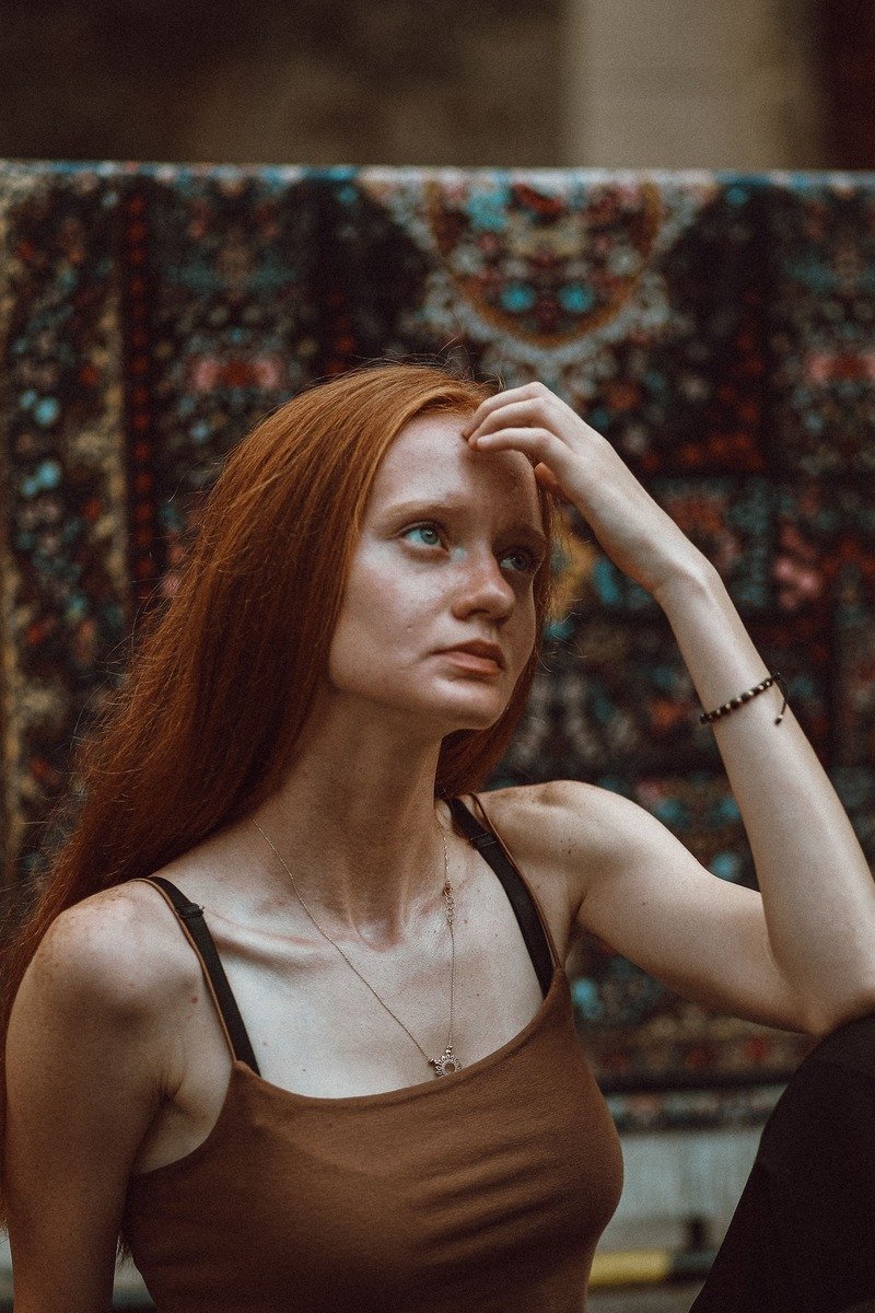 Woman with copper red winter hair color