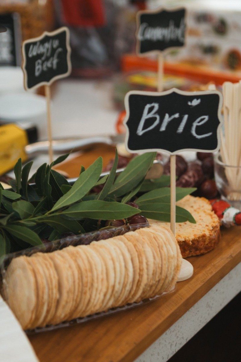 Cheese and crackers arranged on a wooden serving board
