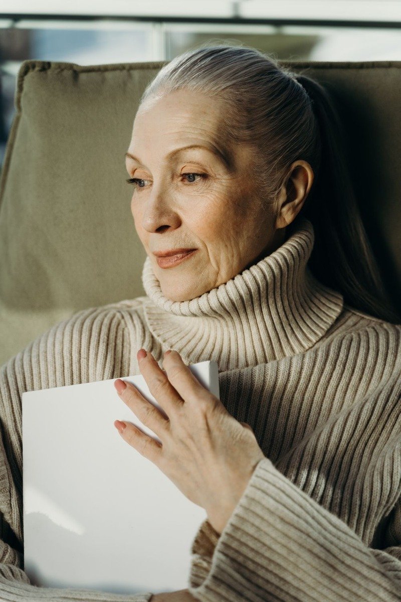 Woman over 50 in a turtleneck sweater