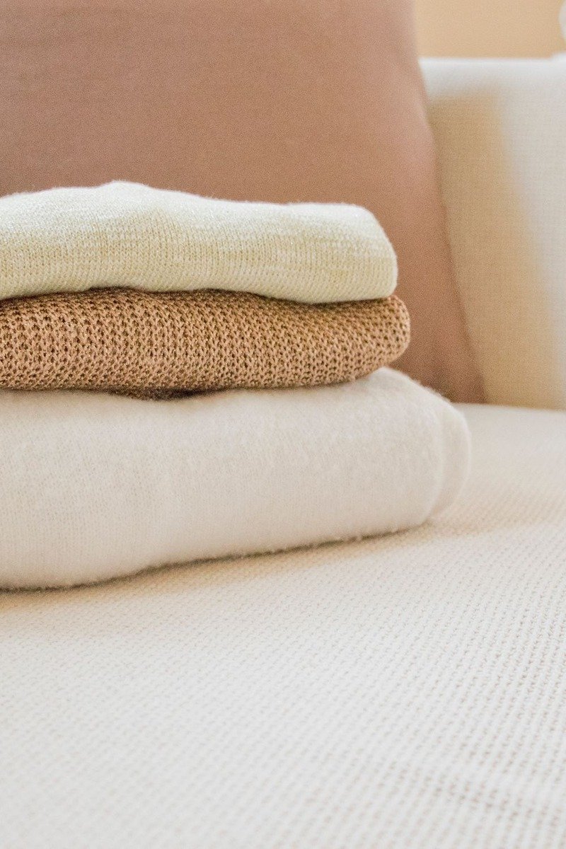 Folded soft throw blanket on a sofa