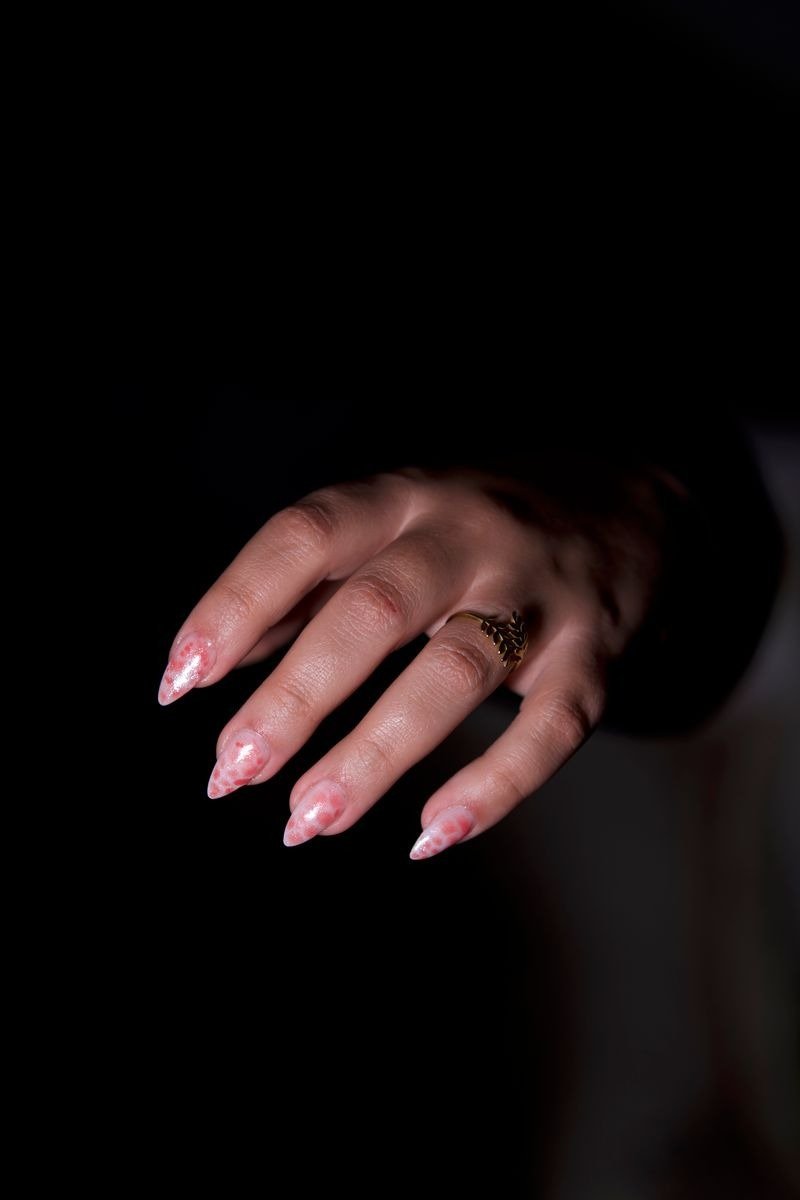 Rose gold metallic nail polish on coffin-shaped nails
