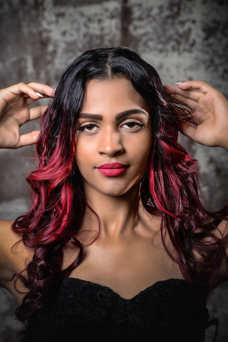 Long layered hair in cherry cola color