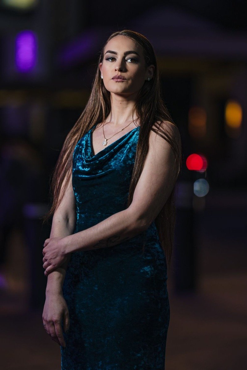 Woman in a velvet midi dress for a December party