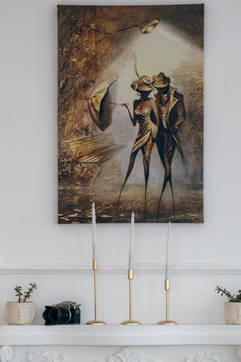 Tall candlesticks on a fireplace mantel