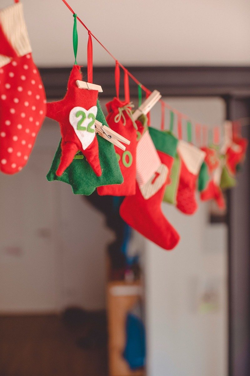 Mini stocking garland advent calendar on a mantel