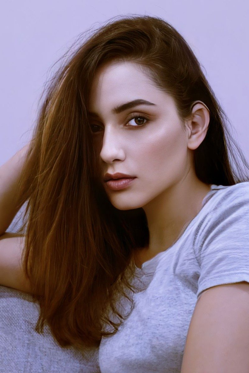 Face-framing mocha balayage pieces brightening the front of long dark hair
