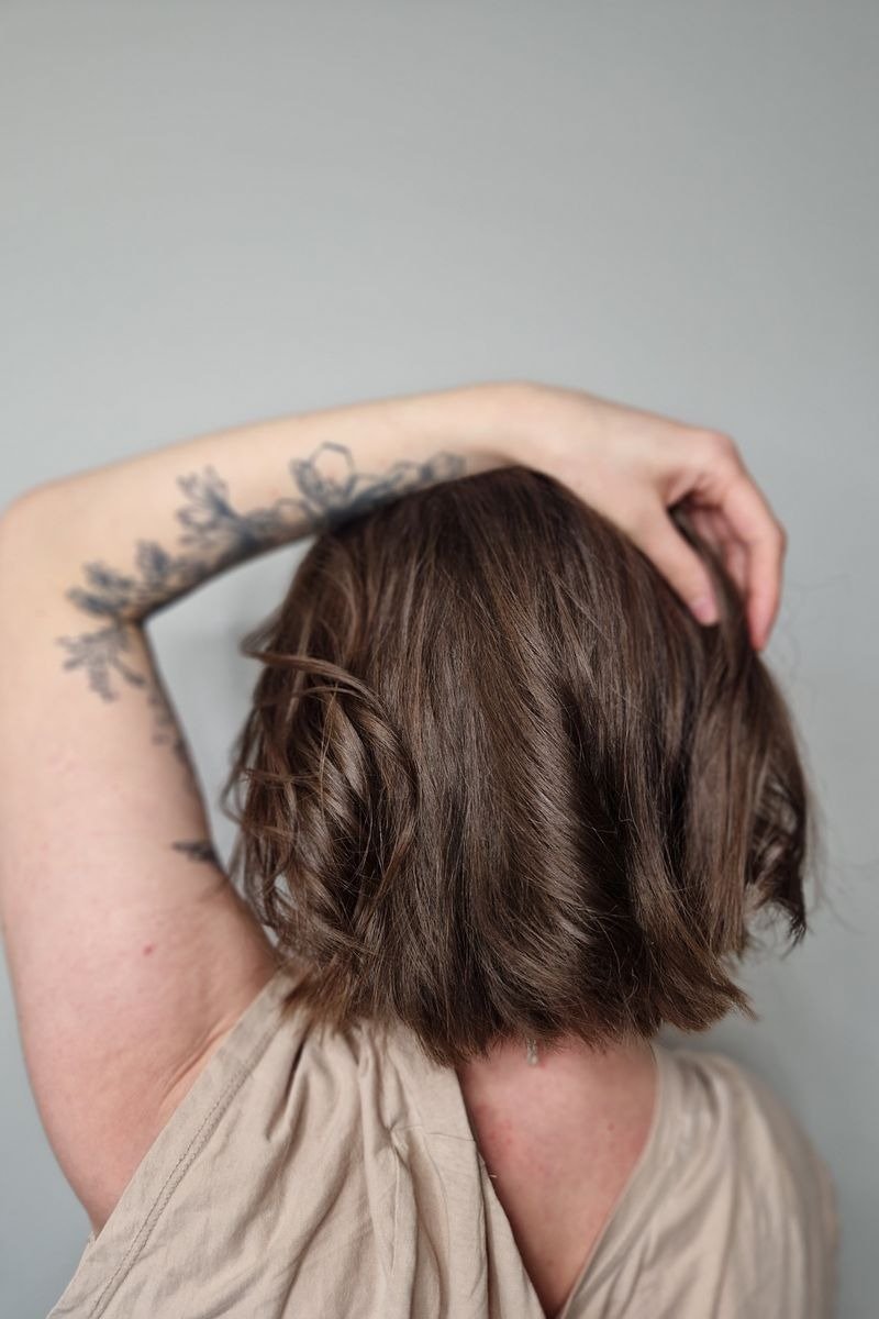 Curly long bob with layers defining natural curl pattern and volume